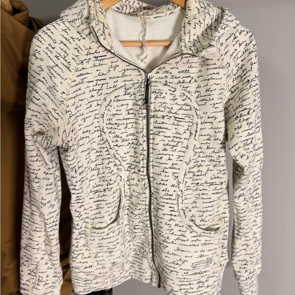 Lululemon Athletica Scuba Hoodie in rare ivory with text design, size 8